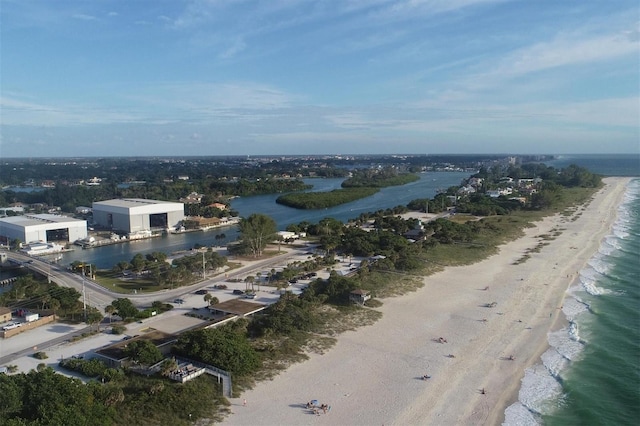 drone / aerial view with a water view and a beach view