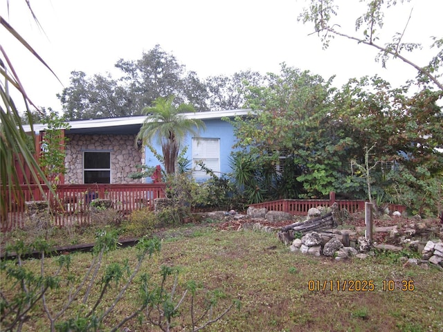 view of yard featuring a wooden deck