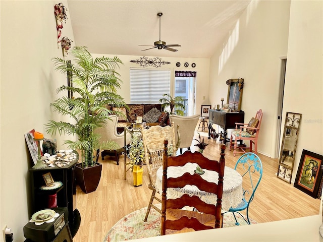 dining area with ceiling fan and hardwood / wood-style floors