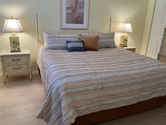 bedroom featuring light hardwood / wood-style flooring and a closet