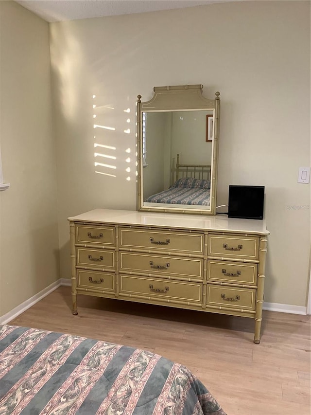 bedroom with light wood-type flooring