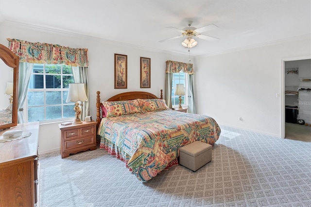 carpeted bedroom with multiple windows, crown molding, and ceiling fan