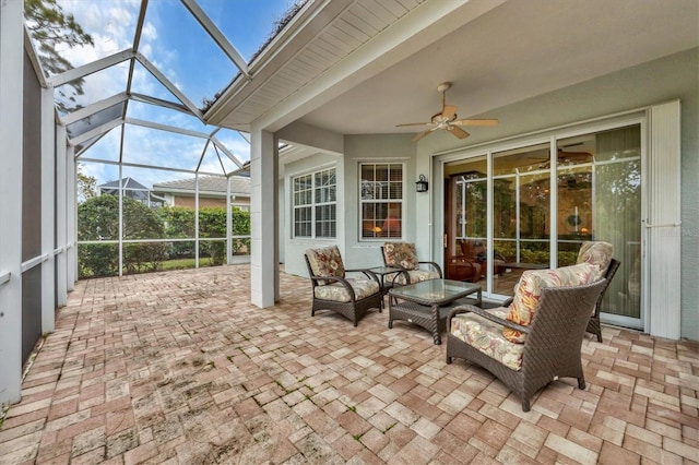 sunroom featuring ceiling fan and lofted ceiling