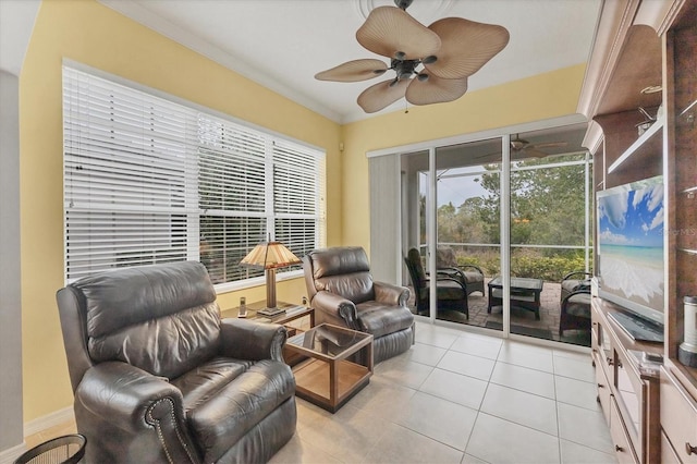 living area with light tile patterned floors and ornamental molding