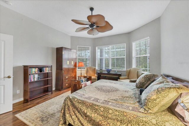 bedroom featuring ceiling fan and hardwood / wood-style flooring