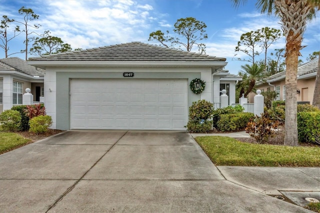 single story home featuring a garage