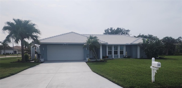 single story home featuring a garage and a front yard