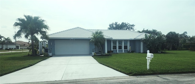 view of front of house with a front lawn and a garage