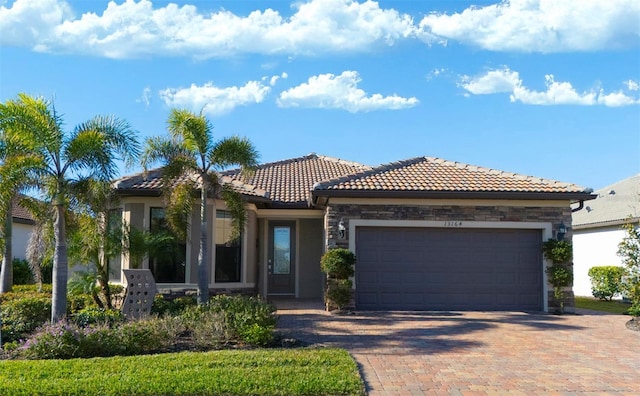 mediterranean / spanish-style house with a garage