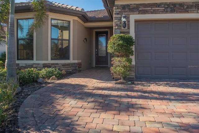 entrance to property featuring a garage