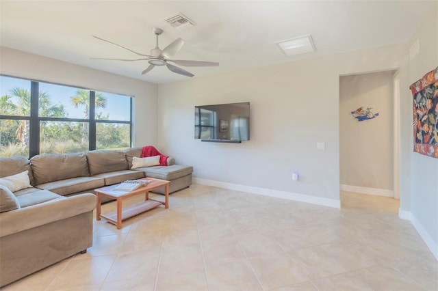 tiled living room featuring ceiling fan