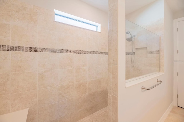 bathroom featuring a tile shower