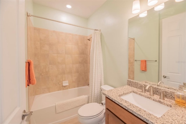 full bathroom featuring shower / bath combo, toilet, and vanity