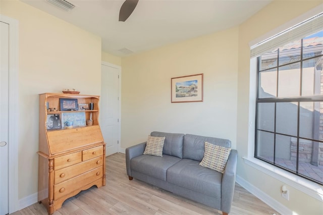 sitting room featuring light hardwood / wood-style floors