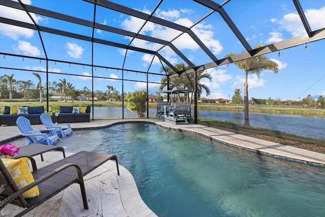 view of swimming pool with a patio area, a lanai, outdoor lounge area, and a water view