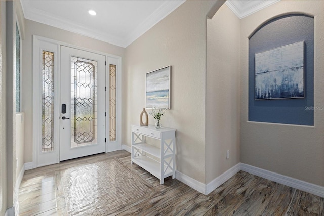 entryway featuring dark hardwood / wood-style flooring and crown molding