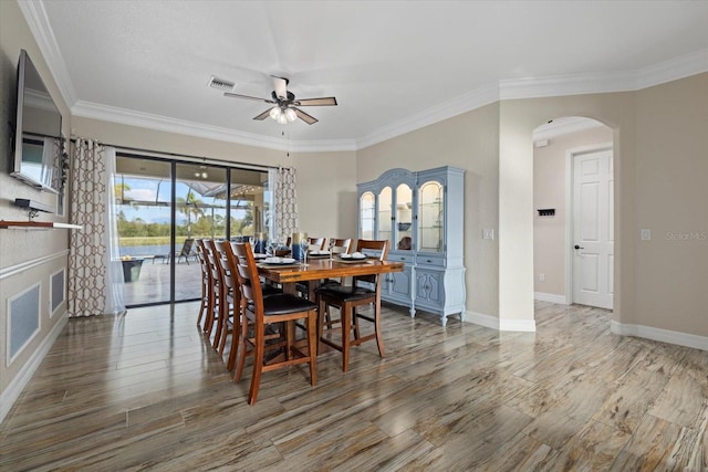 dining room featuring ceiling fan and ornamental molding