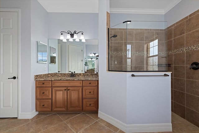 bathroom featuring vanity, tile patterned flooring, crown molding, and tiled shower