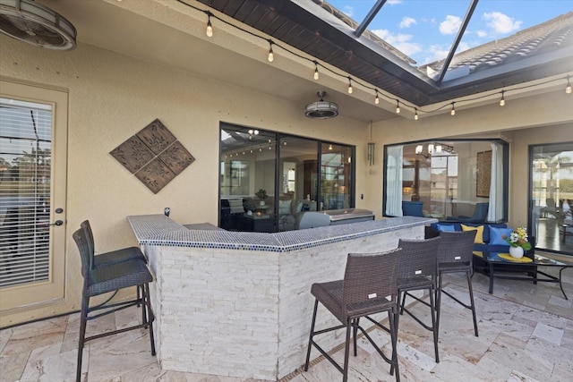 view of patio / terrace with exterior bar