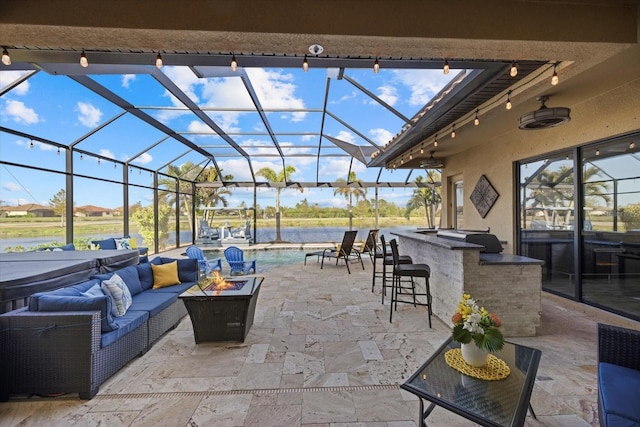 view of patio / terrace featuring a lanai, an outdoor hangout area, a bar, and grilling area