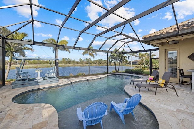 view of swimming pool with a patio area, a lanai, and a water view