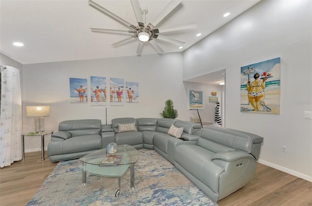 living room featuring high vaulted ceiling, ceiling fan, and hardwood / wood-style floors