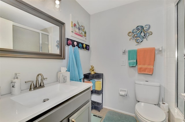 bathroom featuring a shower with door, tile patterned flooring, vanity, and toilet