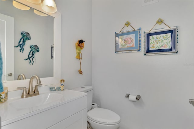 bathroom with toilet and vanity