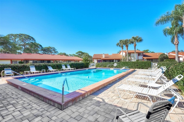 view of swimming pool featuring a patio area