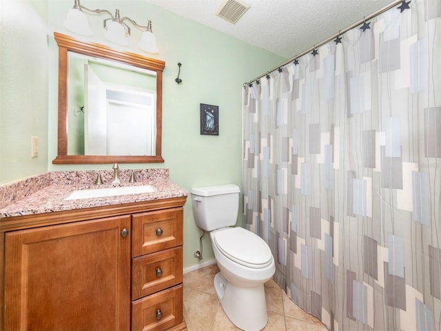 bathroom with curtained shower, tile patterned flooring, a textured ceiling, toilet, and vanity