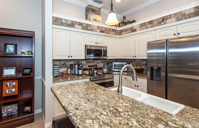 kitchen with white cabinetry and appliances with stainless steel finishes