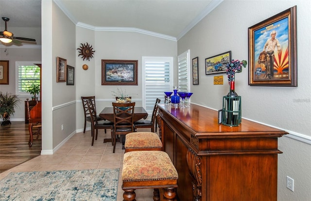 bar with crown molding, ceiling fan, lofted ceiling, and light tile patterned floors