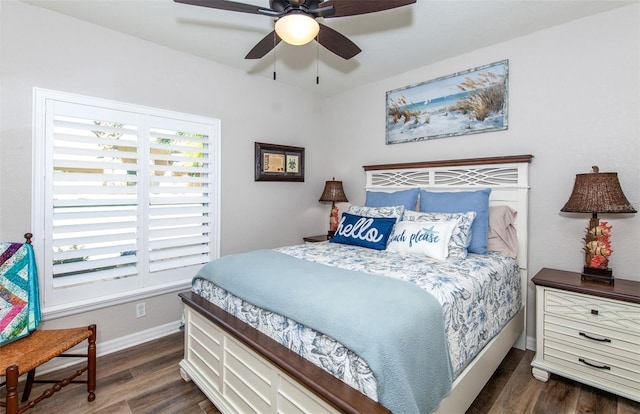 bedroom with ceiling fan and dark hardwood / wood-style floors