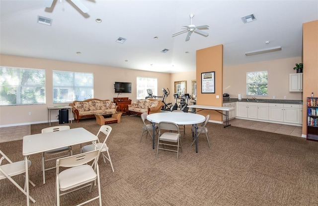 201 Auburn Woods Cir, Venice, FL 34292 - dining room with ceiling fan, light carpet, and light tile patterned floors