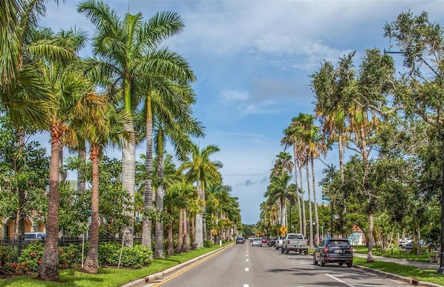 201 Auburn Woods Cir, Venice, FL 34292 - view of asphalt road featuring curbs, sidewalks, street lighting, and traffic signs