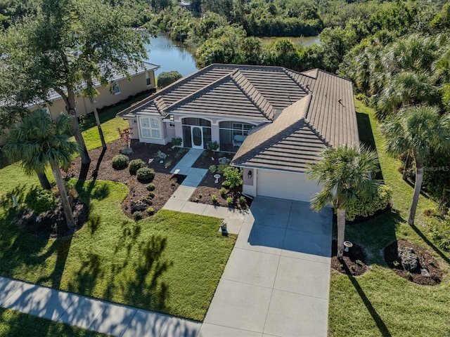 birds eye view of property featuring a water view