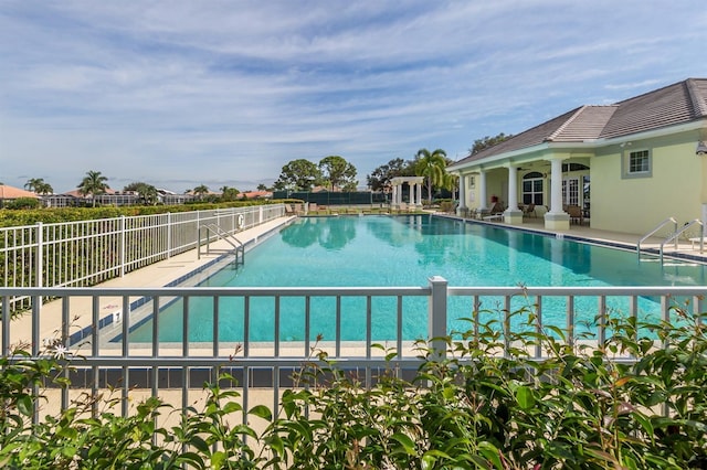 view of swimming pool with a patio