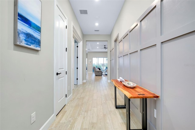 hallway with light wood-type flooring