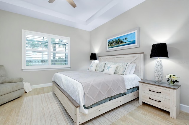 bedroom with ceiling fan and light wood-type flooring