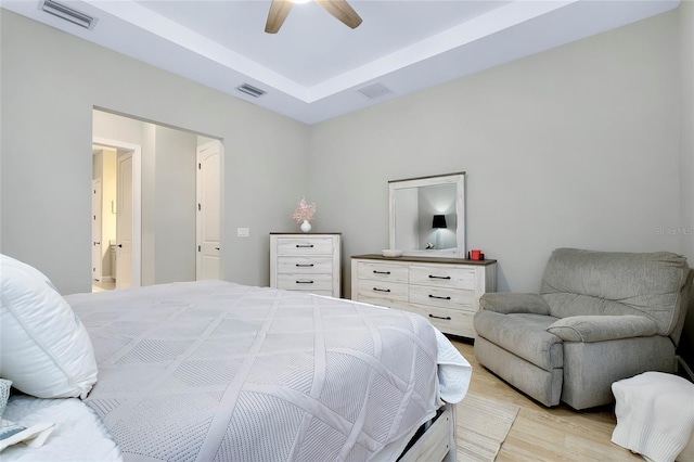 bedroom with ceiling fan and light wood-type flooring