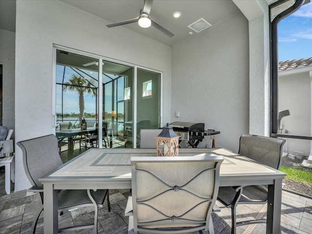 view of patio / terrace featuring ceiling fan and a grill