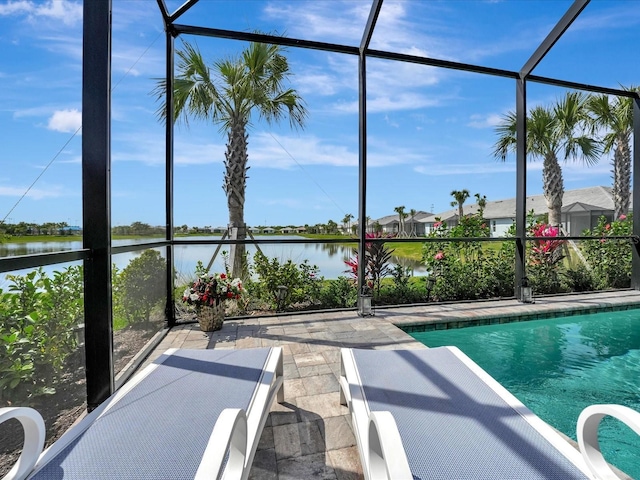 view of pool featuring a water view and a lanai