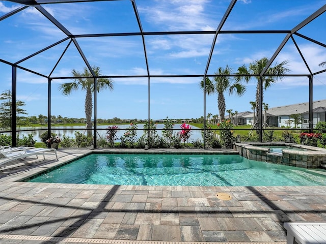 view of pool featuring an in ground hot tub, a lanai, a water view, and a patio