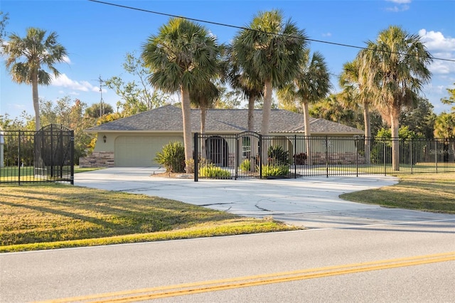 view of front of home featuring a garage and a front yard