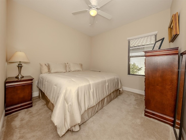 bedroom with light colored carpet and ceiling fan