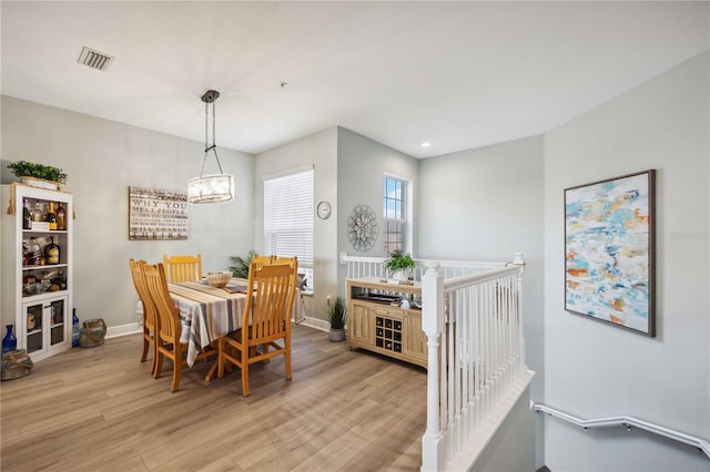 dining area with light wood-type flooring