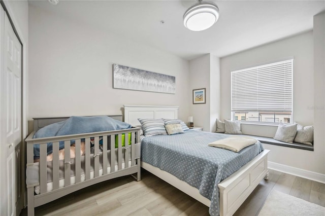 bedroom with light hardwood / wood-style flooring