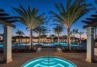 view of swimming pool featuring a hot tub