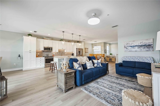 living room featuring light wood-type flooring