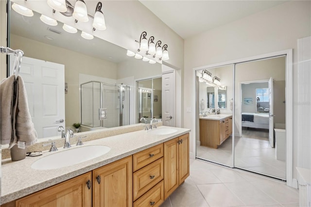 bathroom with vanity, tile patterned floors, and walk in shower